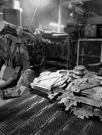 ABB robot operating an aluminum die cast machine at Shawnee Specialties