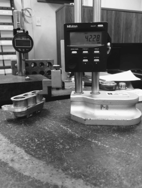 Checking a part height on the surface plate at Shawnee Specialties