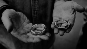 Technician holding a machined part at Shawnee Specialties
